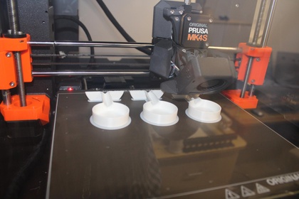 3D printed prototype parts being produced on a print bed