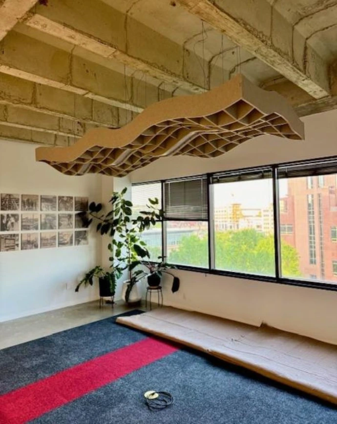 Custom suspended wave-shaped acoustic ceiling baffle
